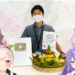 Tim Hololive ID merayakan pencapaian tersebut dengan membuat nasi tumpeng dan mengirimkannya kepada CEO Cover, Motoaki Tanigo, atau yang lebih dikenal sebagai Yagoo.